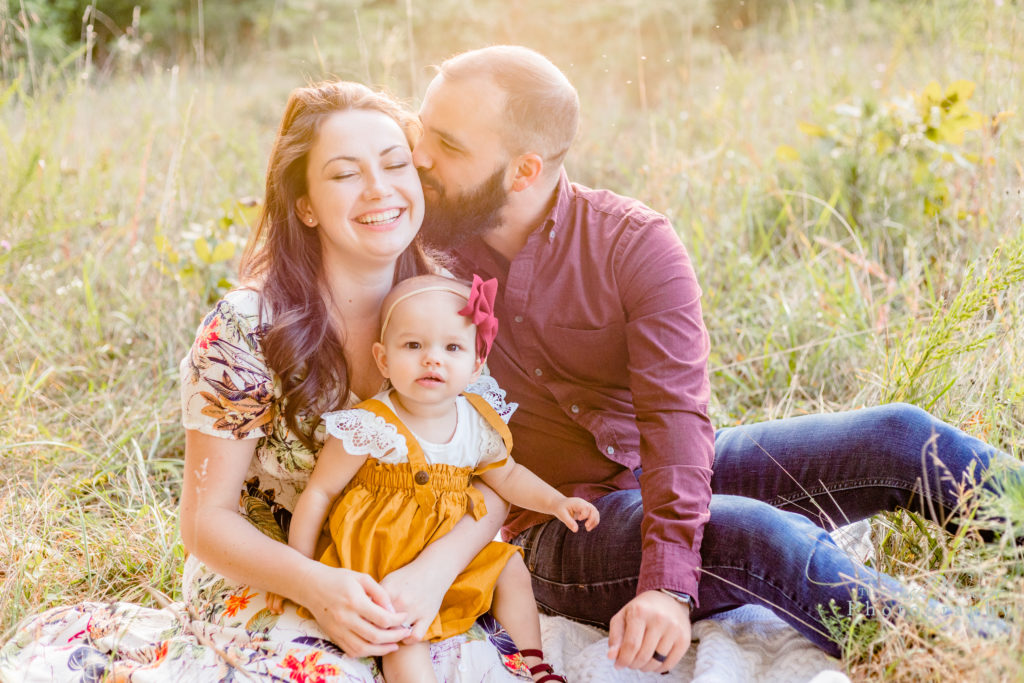 Shenandoah-Valley-family-session-portrait-family-happy-mother-father-kiss-baby-girl