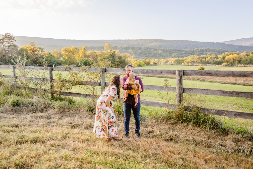 Shenandoah-Valley-family-session-portrait-family-three-fall-kiss-sweet-intimate-love-outdoor-autumn-fun-happy-sunset-mountain-view-fence